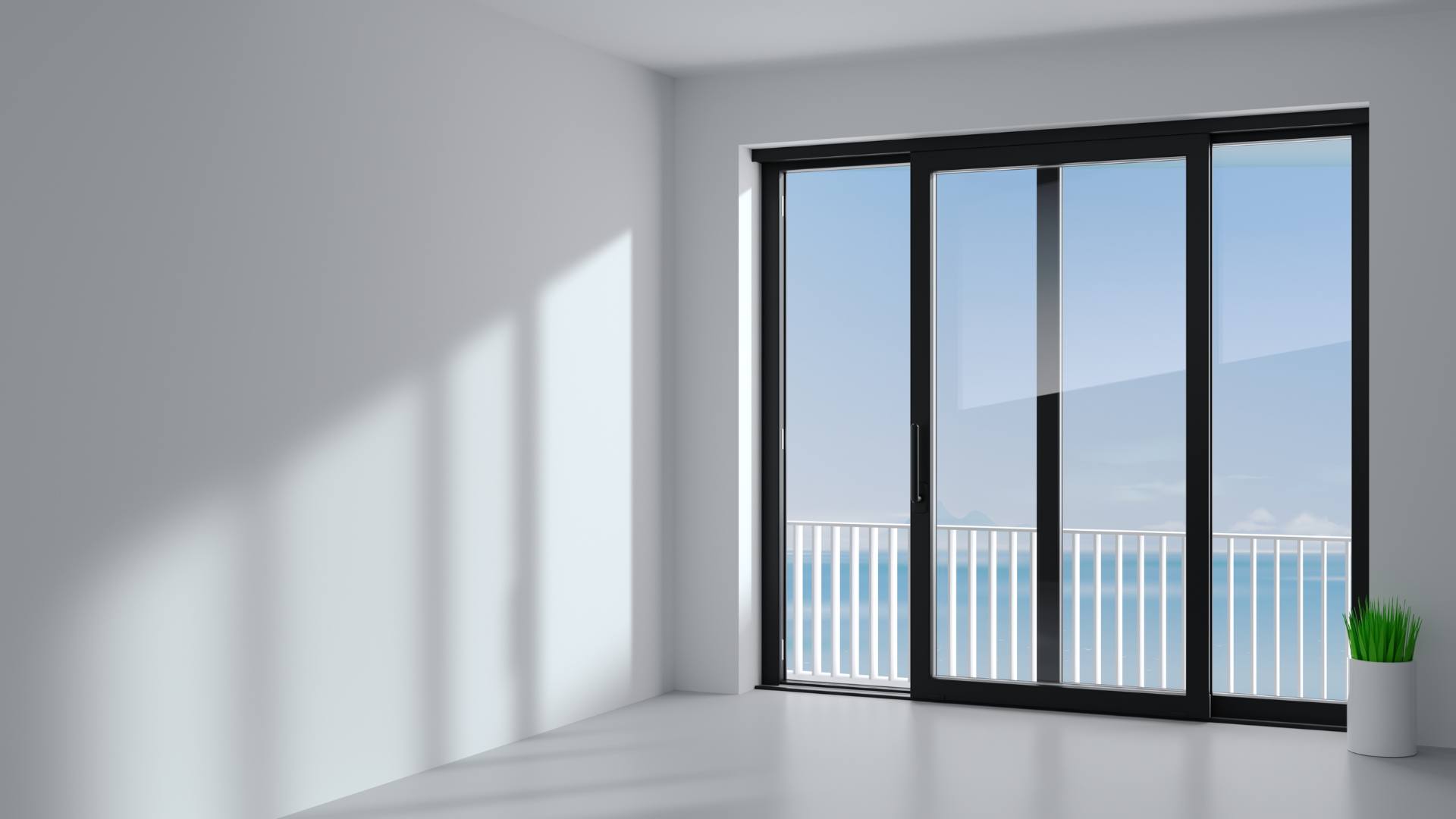 Black-framed glass doors opening to a balcony view