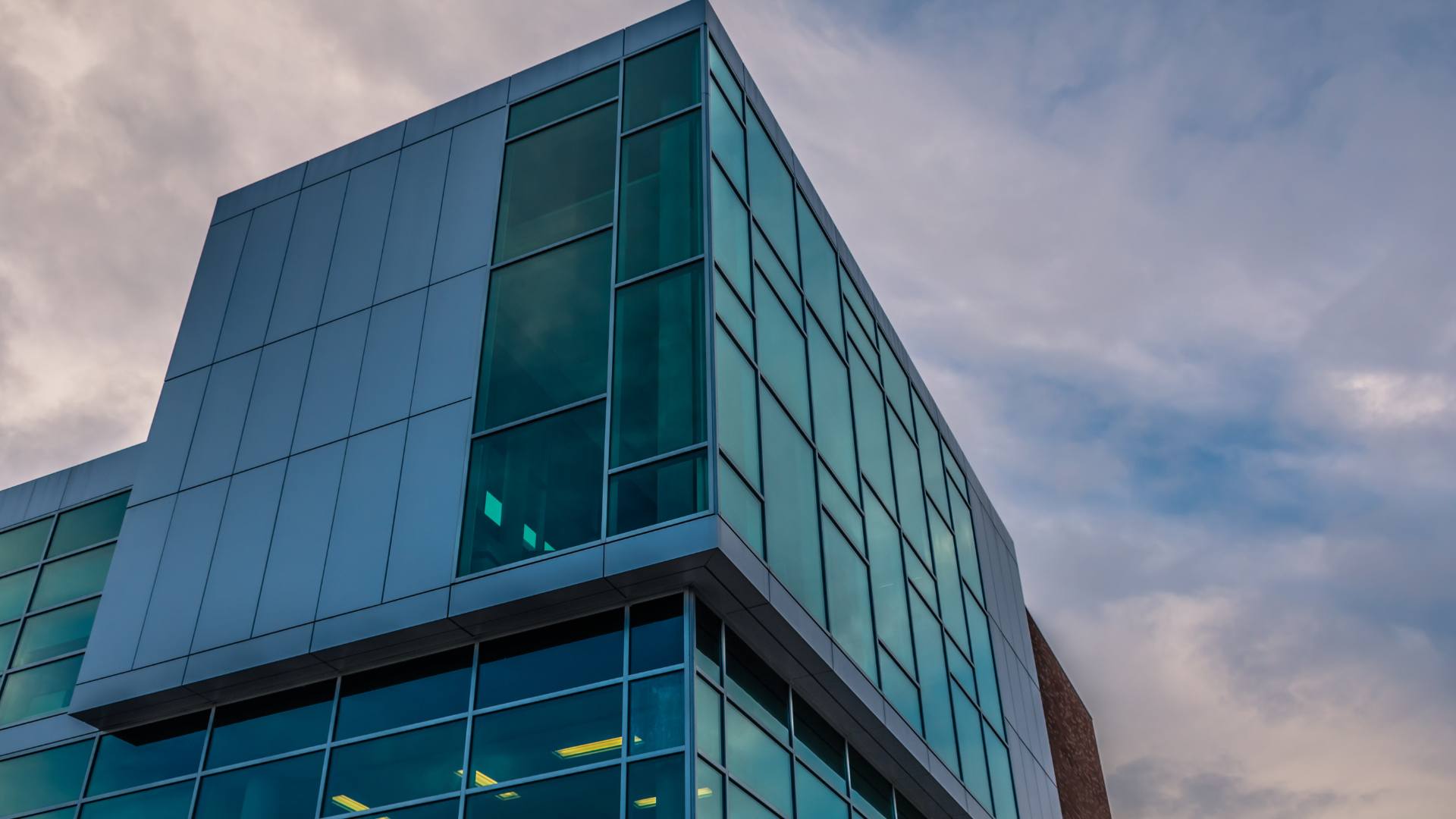 Curved corner building with an extensive glass facade