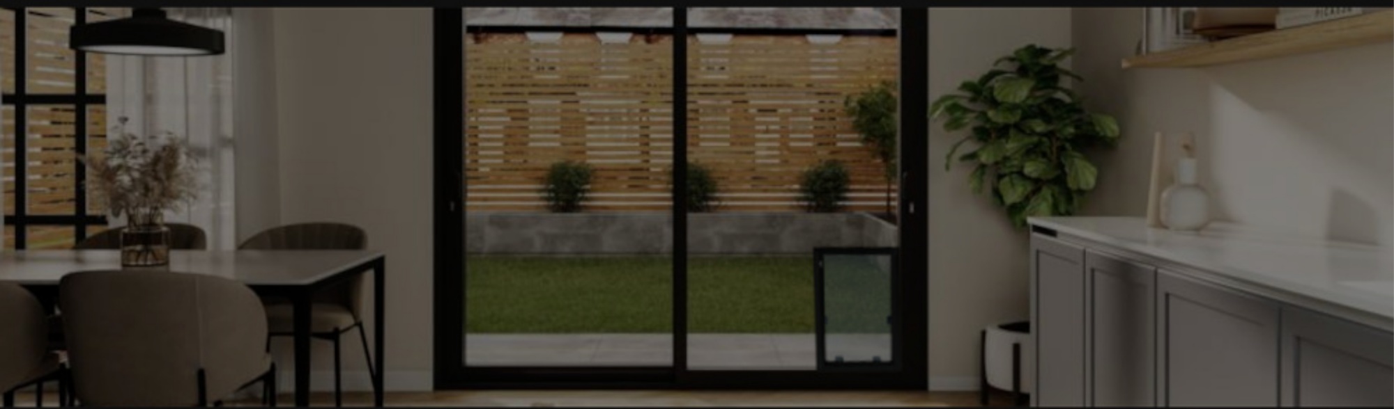 Interior view of glass patio doors with a built-in glass pet door